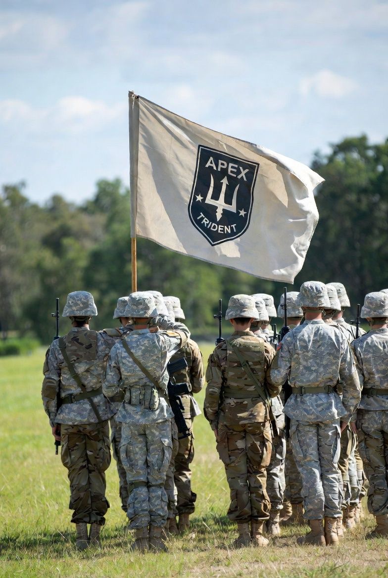 Apex Trident team marching with flag